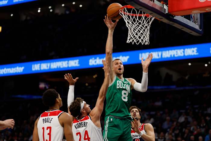 Boston Celtics center Kristaps Porzingis (8) shoots the ball over Washington Wizards forward Corey Kispert (24) in the second quarter at Capital One Arena.
